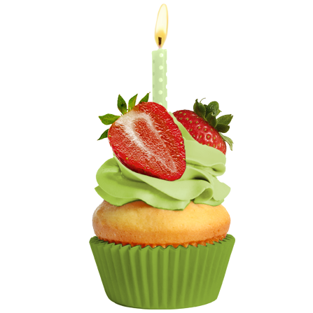 Cupcake with green frosting, strawberries, and candle.